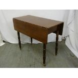 Mahogany Pembroke table on four turned legs with single drawer