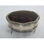 Silver and tortoiseshell trinket box, oval with hinged cover on four scroll legs, Birmingham 1922