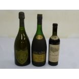 Dom Perignon 1973 vintage champagne, a bottle of Remy Martin brandy and a 1934 bottle of St Estephe