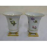 Pair of Herend vases decorated with flowers on claw gilded feet and square bases, marks to the base