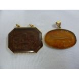 Two Persian pendants set in gold