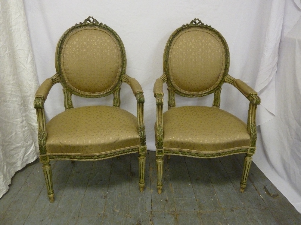 Pair of French style armchairs with upholstered seats and backs on four fluted tapering legs