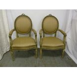 Pair of French style armchairs with upholstered seats and backs on four fluted tapering legs