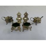 Silver six piece condiments with three spoons and detachable green glass liners, Sheffield 1906 A/F