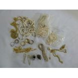 A quantity of costume jewellery to include necklaces, rings, bracelets and earrings