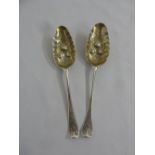 Pair of silver berry spoons of customary form