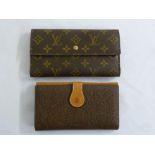 Louis Vuitton of Paris wallet and a Mulberry wallet
