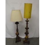 Two carved gilt wood 17th century style candle sticks converted to floor lamps A/F