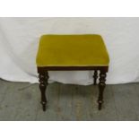 Victorian upholstered piano stool on four turned legs
