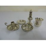 A quantity of hallmarked silver to include a George III pepperette, a chamber stick, a coaster, a