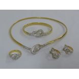 18ct gold and diamond suite of jewellery to include a necklace, a bangle, a pair of earrings and a