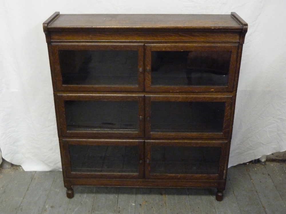 Oak three section glazed bookcase