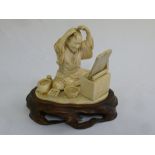 Japanese early 20th century ivory figure on carved hardwood stand A/F