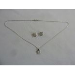 14ct white gold and diamond pave set pendant and 14ct white gold chain and matching earrings, approx
