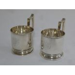 Pair of Russian silver tea glass holders, cylindrical form, milled borders with angle handles, marks