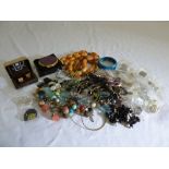 A quantity of costume jewellery to include brooches, bracelets, necklaces and cufflinks