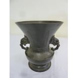 Bronze vase with two side handles in the form of elephants heads