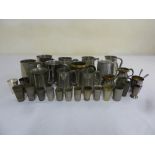 A quantity of Pewter tankards and measuring cups (32)