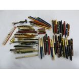 A quantity of fountain pens, propelling pencils and dip pens
