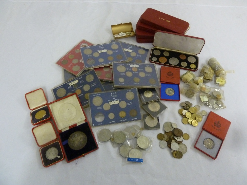 A quantity of English coins to include year sets, proof sets, cuni crowns and medallions