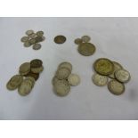 A quantity of silver coins to include pre 1920 silver and 1933 New Zealand 2/6