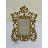 Gilt metal photograph frame, scroll pierced with leaves and shells