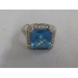 White gold blue topaz and diamond ring (tested 18ct), approx 7.5g