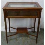 Edwardian glazed display case on four tapering legs with hinged top