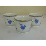 Three Herend cache pots decorated with blue and white sprays of flowers