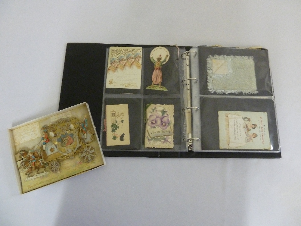 A quantity of greetings cards to include an early Hebrew card in a loose album
