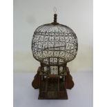 Victorian style metal and wood bird cage of oriental form