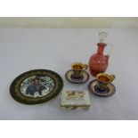 A cranberry glass bottle and stopper, pair of Czechoslovakian cabinet coffee cups, a Limoges box and