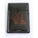 Japanese lacquered swivel card case decorated with stylised leaves