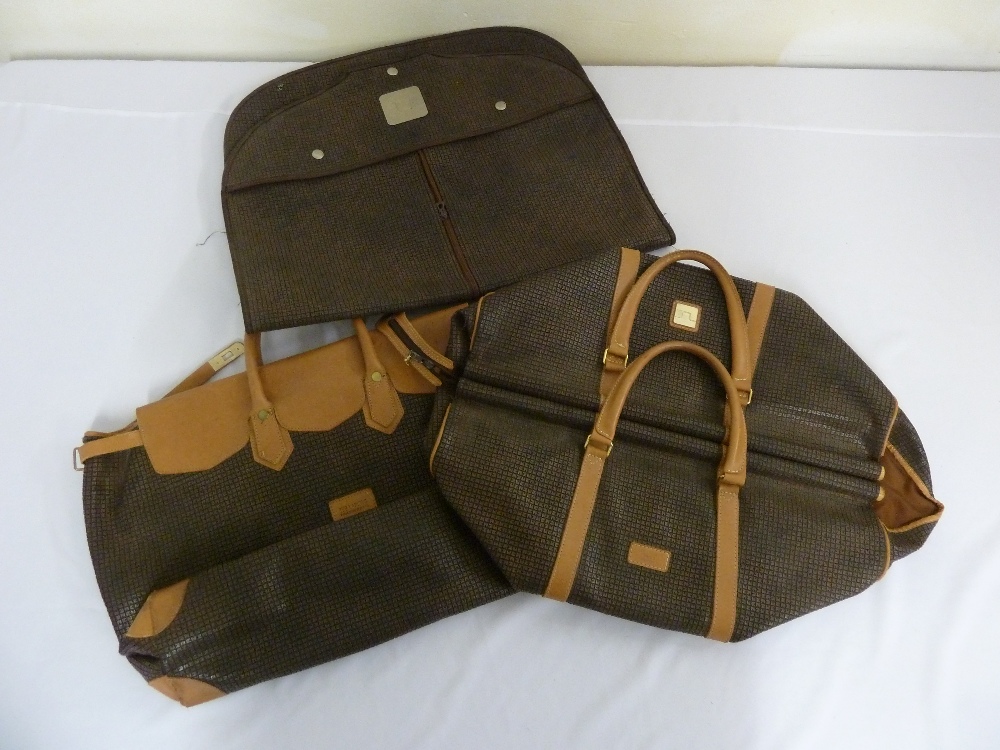 Ted Lapidus three leather suitcases to include two holdalls and a suit bag