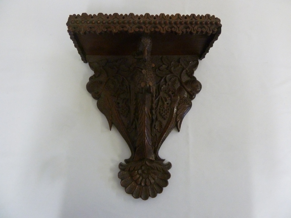 Black Forest wall bracket carved with a bird, leaves and branches A/F