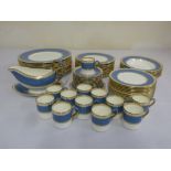 Wedgwood blue and gold dinner service to include a sauce boat on stand, coffee cups and saucers (