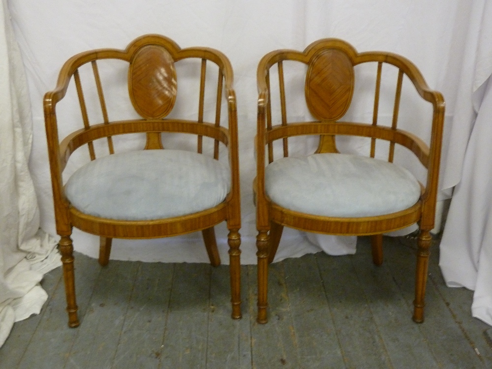 A pair of Biedermeier style inlaid arm chairs with upholstered seats