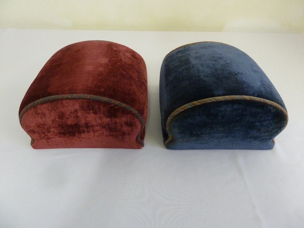 A pair of ovoid upholstered foot rests