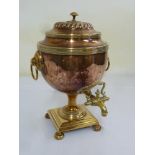 An early 20th century brass and copper samovar