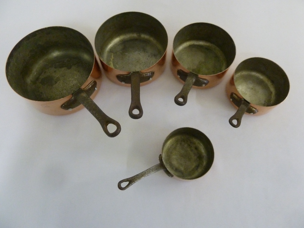 Five French copper and iron cooking pans