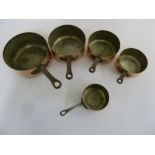Five French copper and iron cooking pans