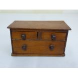 A mahogany miniature apprentice piece chest of drawers of rectangular form with three drawers A/F