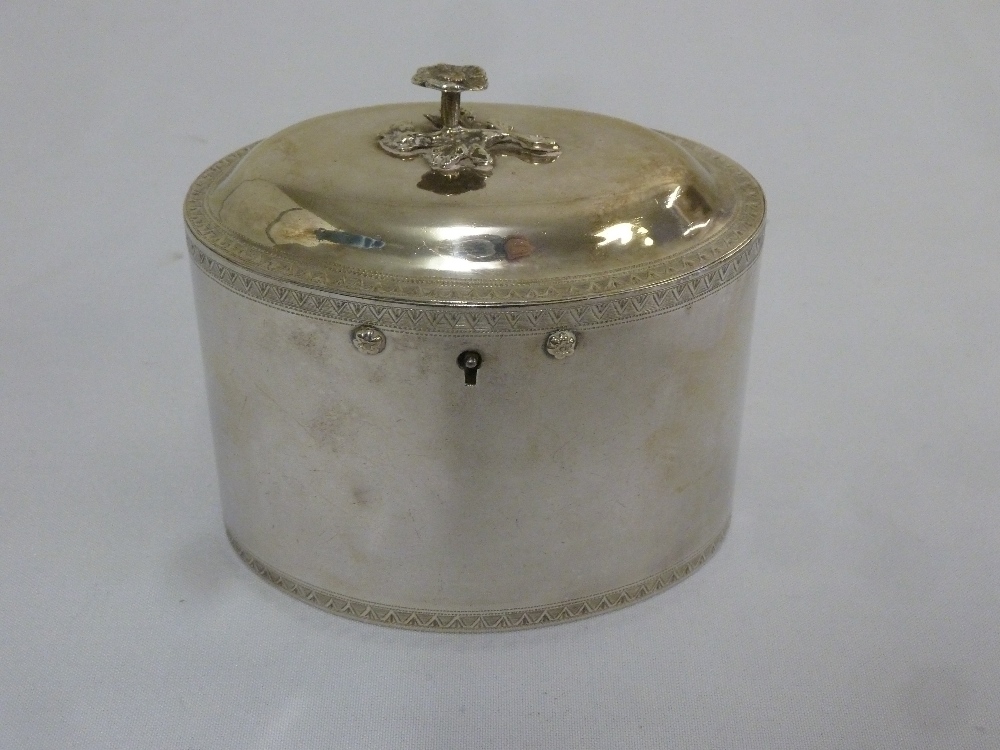 A rare 18th century York silver tea caddy of oval form, engraved chevron bands, the raised hinged