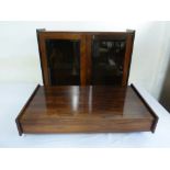 Rosewood hanging wall cabinet with hinged glazed doors above a detachable matching shelf with