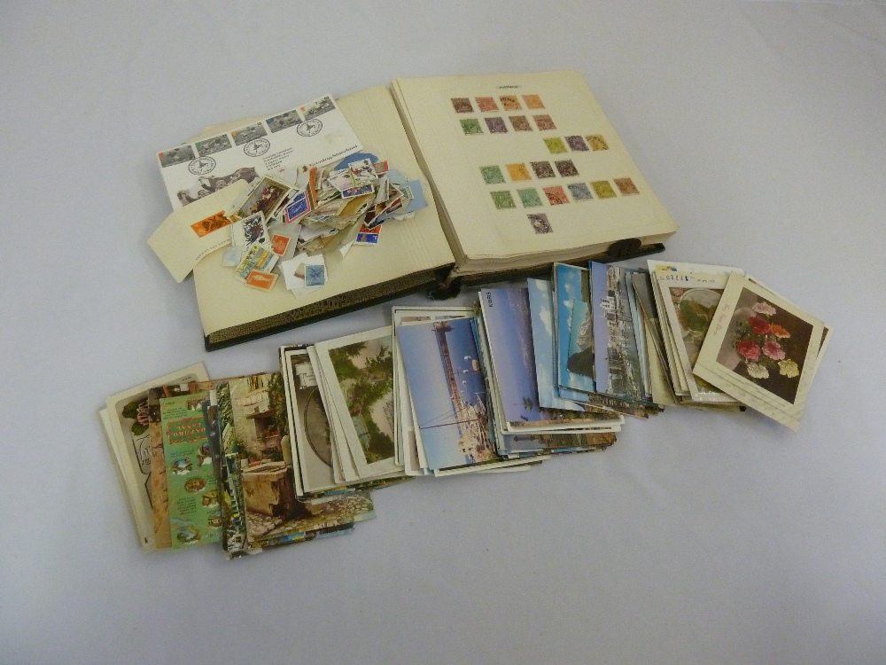 A quantity of stamps and postcards to include one album and loose stamps
