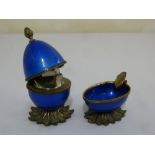 An American gilt metal and enamel table lighter and matching ashtray