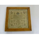 A mid Victorian sampler in maple wood frame