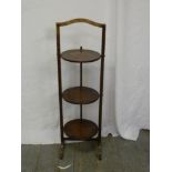 Oak three tier plate stand of customary form