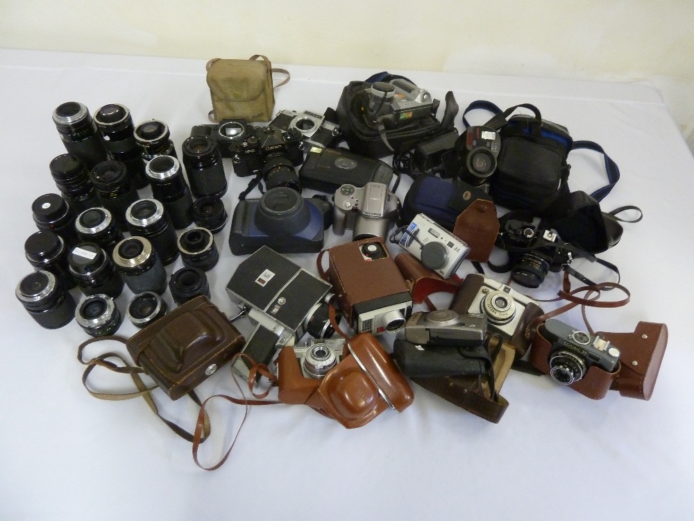 A quantity of cameras and lenses to include Canon, Olympus, Chinon, Sigma and Tamron (38)