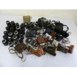 A quantity of cameras and lenses to include Canon, Olympus, Chinon, Sigma and Tamron (38)